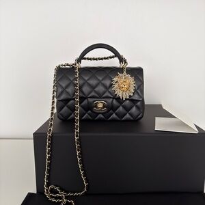CHANEL metiers d’art ‘23 Black Lambskin Mini Top Handle Flap Bag with Lion Charm